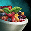 Bowl of Fruit Salad with Mint Garnish.png