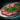 Plate of Beef Carpaccio with Mint Garnish