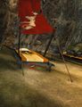 In the sleeping quarters beyond the door which had to be unlocked, underneath the bed with the red awning.