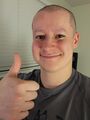 With shaved head and eyebrows from Extra Life 2023