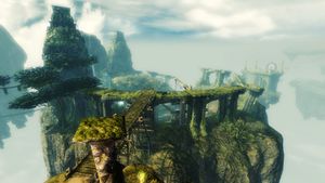A view of the Mists Arena from outside. The Arena itself is obscured by the raised spectator platform around the edge. The entrance portal can be seen on the right side.