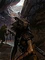 A group of skritt at a cavern entrance